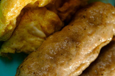 Closeup macro breakfast sausage with plastic utensils as fun kids breakfastの写真素材