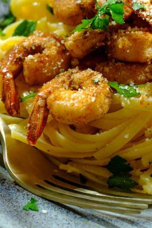 Italian fettuccine alfredo with cajun shrimp served with pinot grigio white wineの写真素材