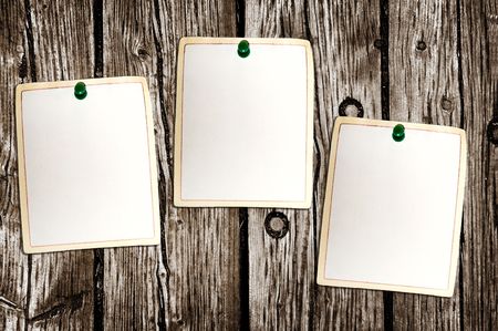 Clean paper sheets attached to the wooden backgroundの写真素材