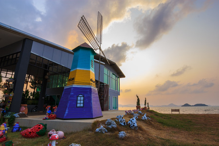 Wind mill simulation in front a bulding near sea.のeditorial素材