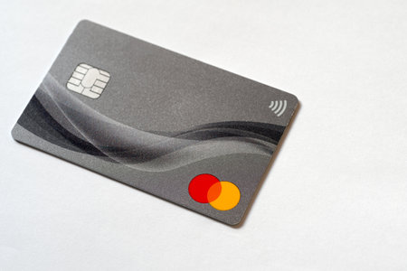 Mastercard credit card on a white surface with copy spaceのeditorial素材
