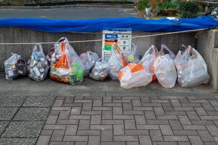 Segregation of recyclable wastes with different plastic bags at a garbage collection point in Kitakyushu, Japanのeditorial素材