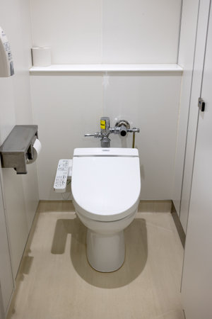 Public toilet in Japan with toilet paper dispenser and automatic bidetのeditorial素材