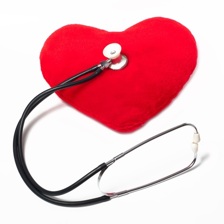 Red plush heart and stethoscope on a white backgroundの写真素材