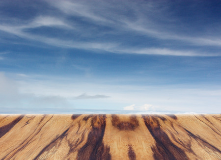wooden table with blurred sky for backgroundの写真素材