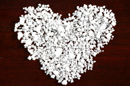 Sea salt on wooden tableの写真素材