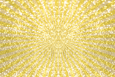 yellow and gold glitter bokeh on star burst backgroundの写真素材