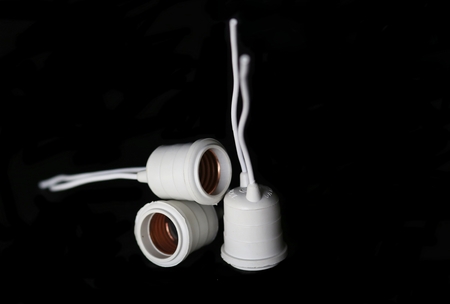 plug, light bulb, electric light, lamp on black backgroundの写真素材