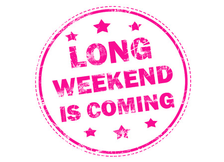 LONG WEEKEND IS COMING on pink grunge rubber stampの写真素材