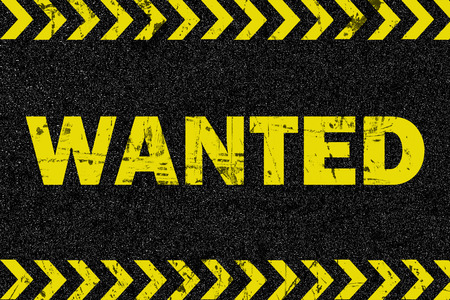 WANTED on grunge rubber blackboardの写真素材