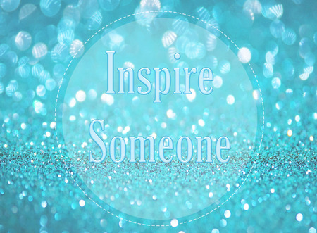 Inspire someone word on blue abstract bokeh backgroundの写真素材