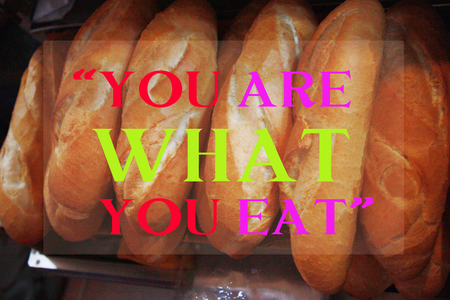 you are what you eat quote on french bread backgroundの写真素材
