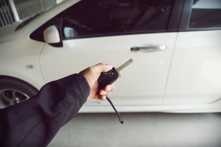 Hand holding remote control car keyの写真素材