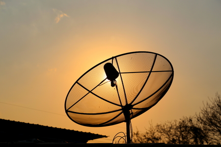 Satellite TV on the roof of rural house in Thailandの写真素材