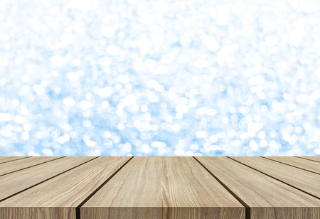 wooden table on white blue glitter backgroundの写真素材