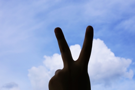 two fingers on the skyの写真素材