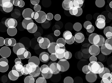 white bokeh abstract on black backgroundの写真素材