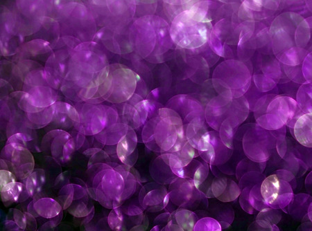 Purple bokeh abstract on black backgroundの写真素材