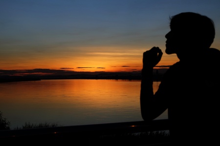 Teenager playing on sunset timeの写真素材
