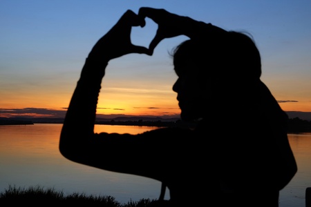Teenager playing on sunset timeの写真素材