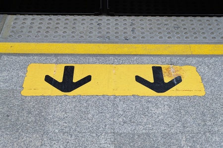 arrow sign on the floorの写真素材