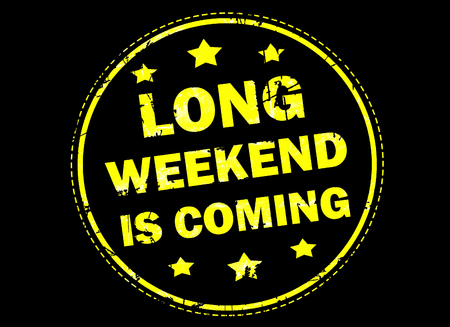Long weekend is coming grunge rubber stamp on black backgroundの写真素材