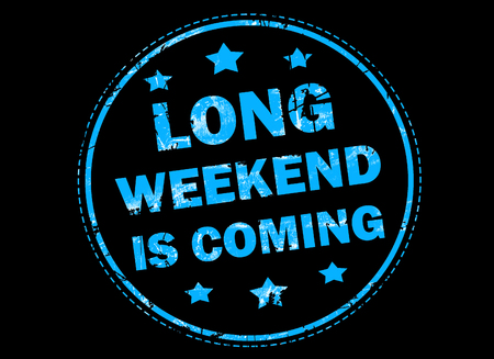 Long weekend is coming grunge rubber stamp on black backgroundの写真素材