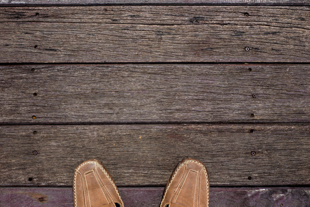 Man shoes with copy space on wooden floor backgroundの写真素材