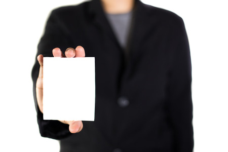 Businessman holding blank white paper, modern business background concept.の写真素材