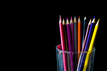 Color pencil on black background with copy spaceの写真素材