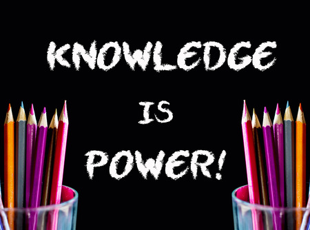 Color pencil on black background with word: KNOWLEDGE IS POWERの写真素材