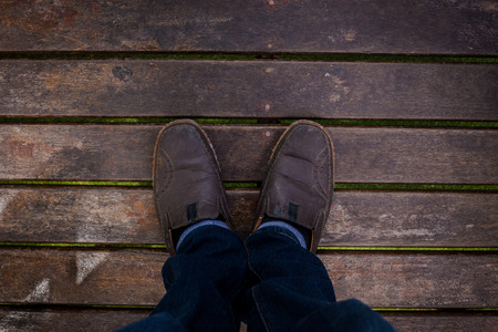 working man shoes on wooden floor with copy spaceの写真素材