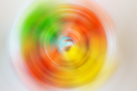 Red, green and yellow made by twirl mode for background.の写真素材
