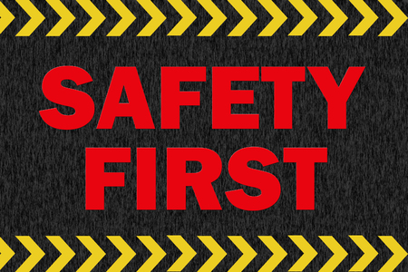 SAFETY FIRST sign on black backgroundの写真素材