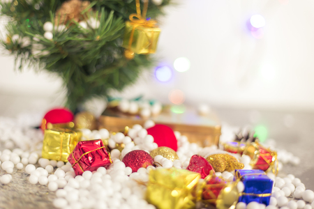 Gift boxes and ornaments in Merry Christmas and Happy New Year concept with bokeh background, can be use for make a greeting cards.の写真素材