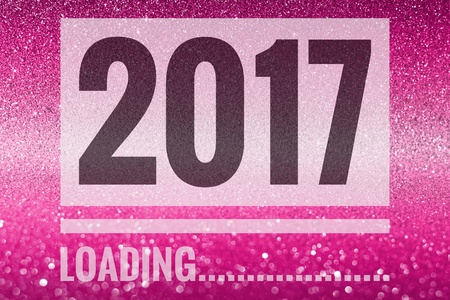 Happy new year 2017 words on shiny pink glitter backgroundの写真素材