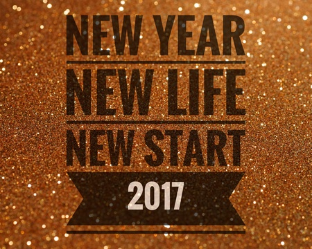 Happy new year 2017 words on shiny gold glitter backgroundの写真素材