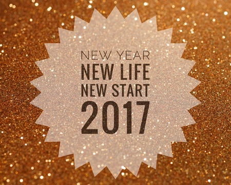 Happy new year 2017 words on shiny gold glitter backgroundの写真素材