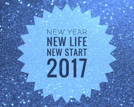 Happy new year 2017 words on shiny purple and blue glitter backgroundの写真素材