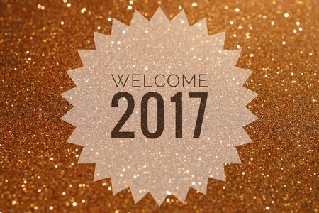 Happy new year 2017 words on shiny gold glitter backgroundの写真素材