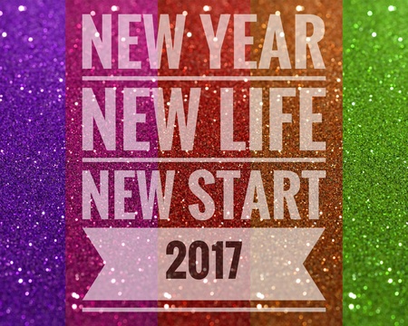 Happy new year 2017 words on shiny colorful glitter backgroundの写真素材