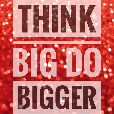 Think big do bigger sign on red glitter backgroundの写真素材