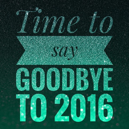 Welcome 2017, Happy New Year and good bye 2016 words on shiny green and black glitter background.の写真素材