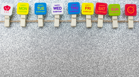 Mon-Tue-Wed-Thu-Fri -Sat-Sun on white silver shiny glitter background, Can be use for list to do in a week.の写真素材