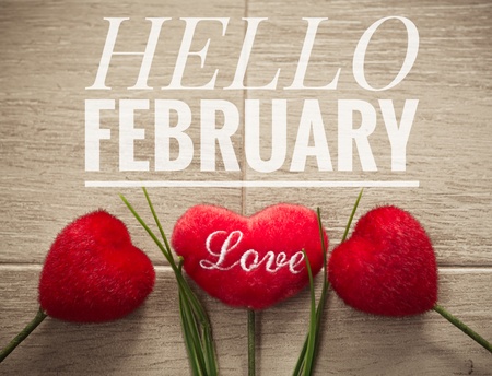 Hello February words on red heart and wooden backgroundの写真素材
