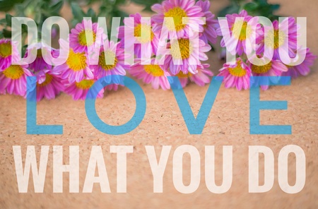 Do what you love, love what you do words on pink and wooden background.の写真素材