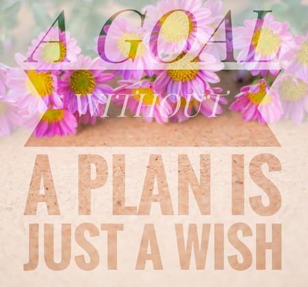 A goal without a plan is just a wish words on pink and wooden background.の写真素材