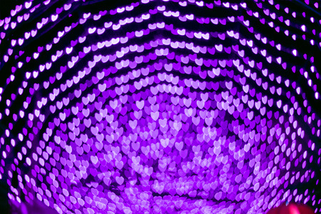 Purple heart bokeh abstract background from night light Chinese new year festival.の写真素材