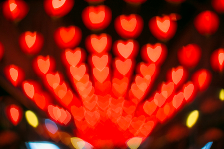 Red heart bokeh abstract background from night light Chinese new year festival.の写真素材