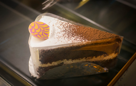 Close up of a part of cake in coffee shop.
